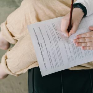 Young child completing a questionnaire indoors for educational purposes.